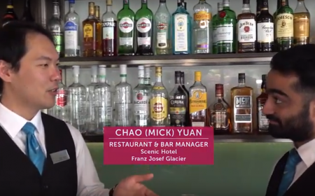 Mick Yuan with staff member