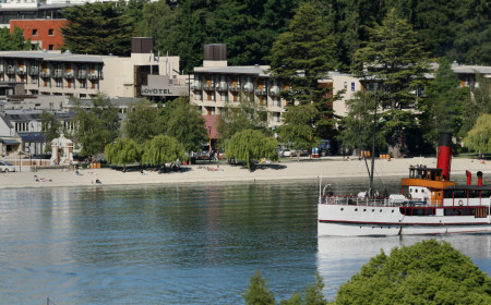 Novotel Queenstown on Queenstown Bay lakefront with TSS Earnslaw